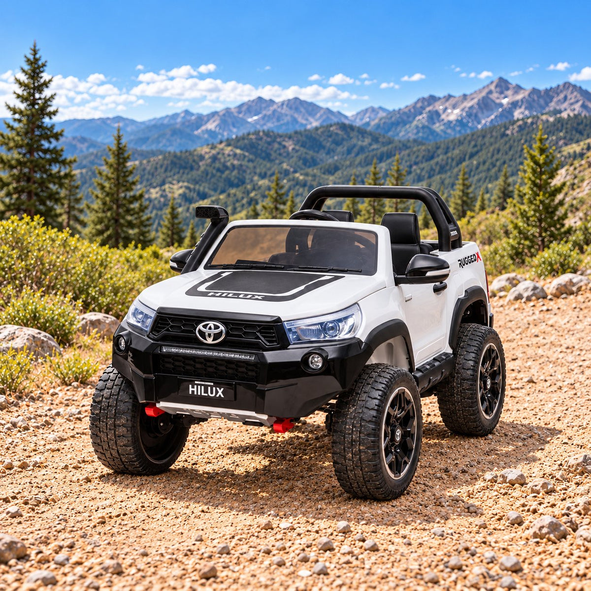 White kids' ride-on Hilux on a mountain trail