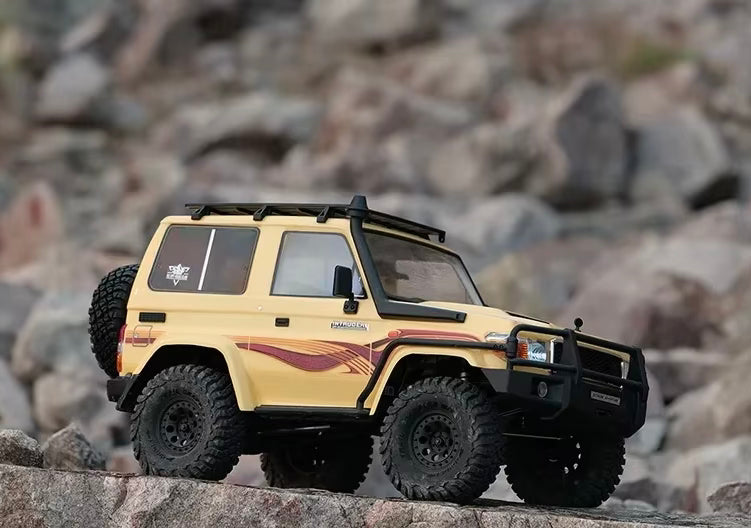 Tan RC crawler truck on rocks